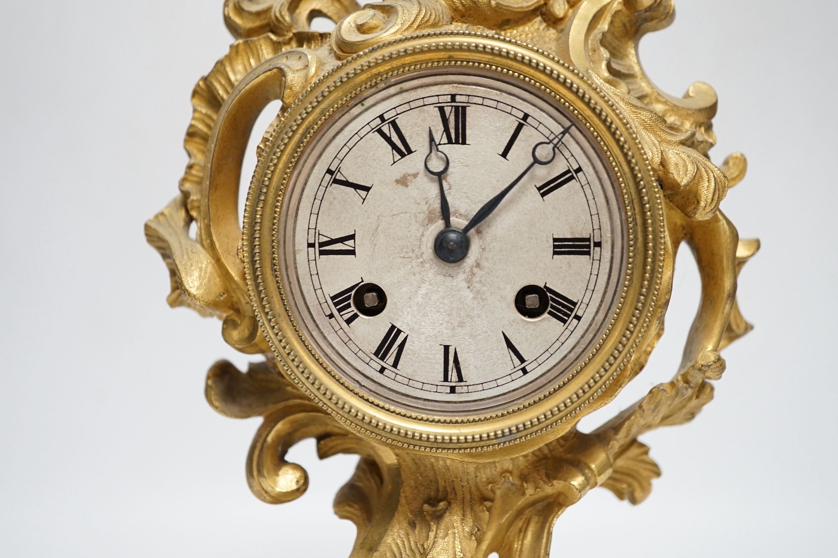 A 19th century French rococo-style ormolu mantel clock with Raingo movement striking on a bell (missing pendulum), 29cm